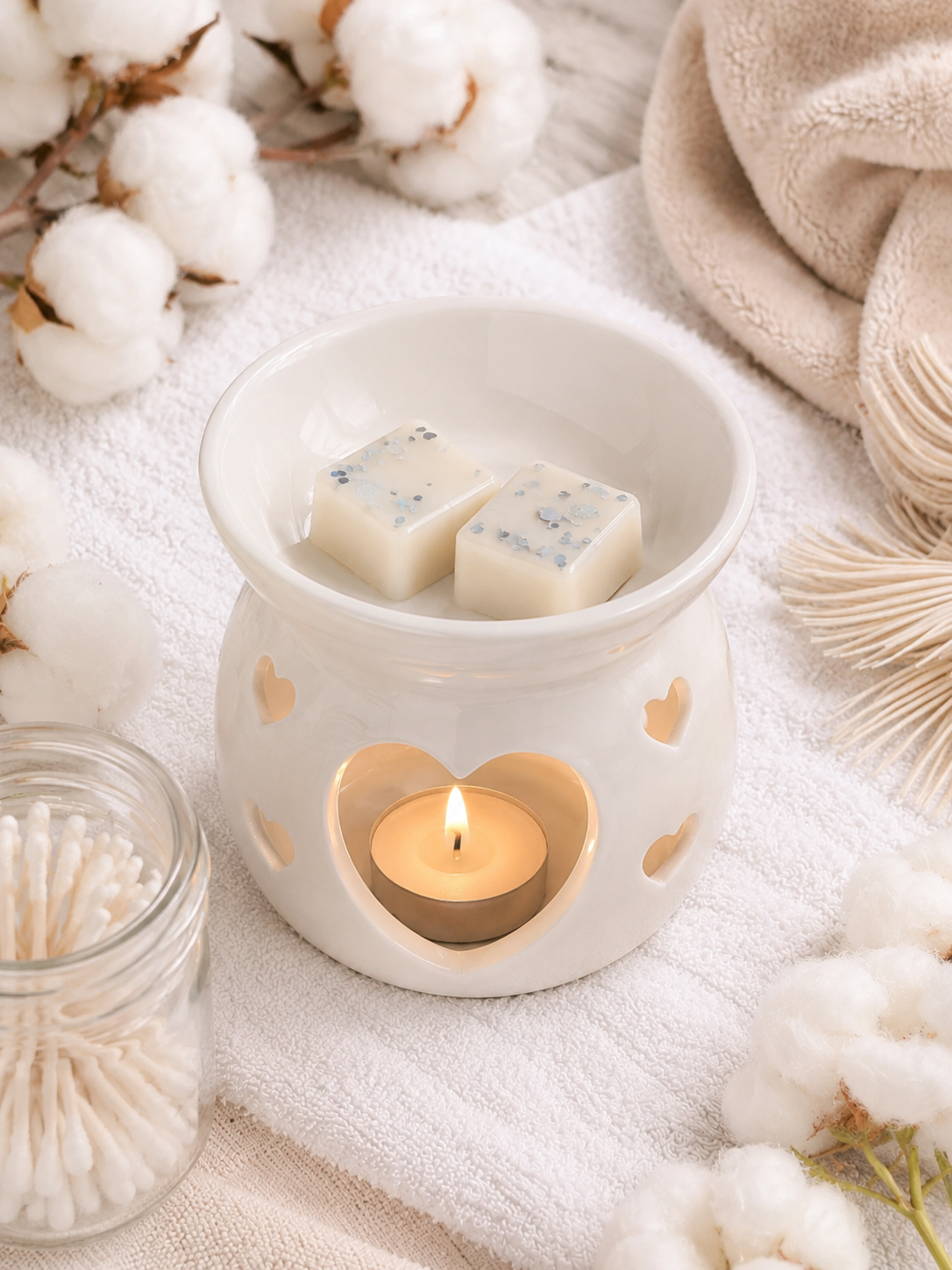 egyptian cotton wax melt in burner with cosy clean background theme.