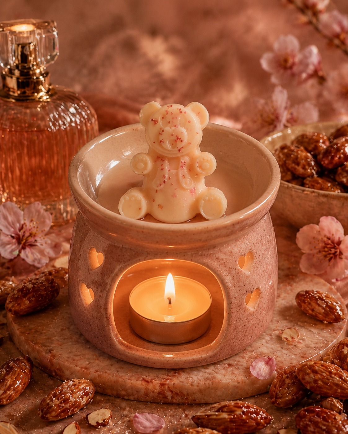 Glazed almond dreams bear wax melt in burner with cosy background.