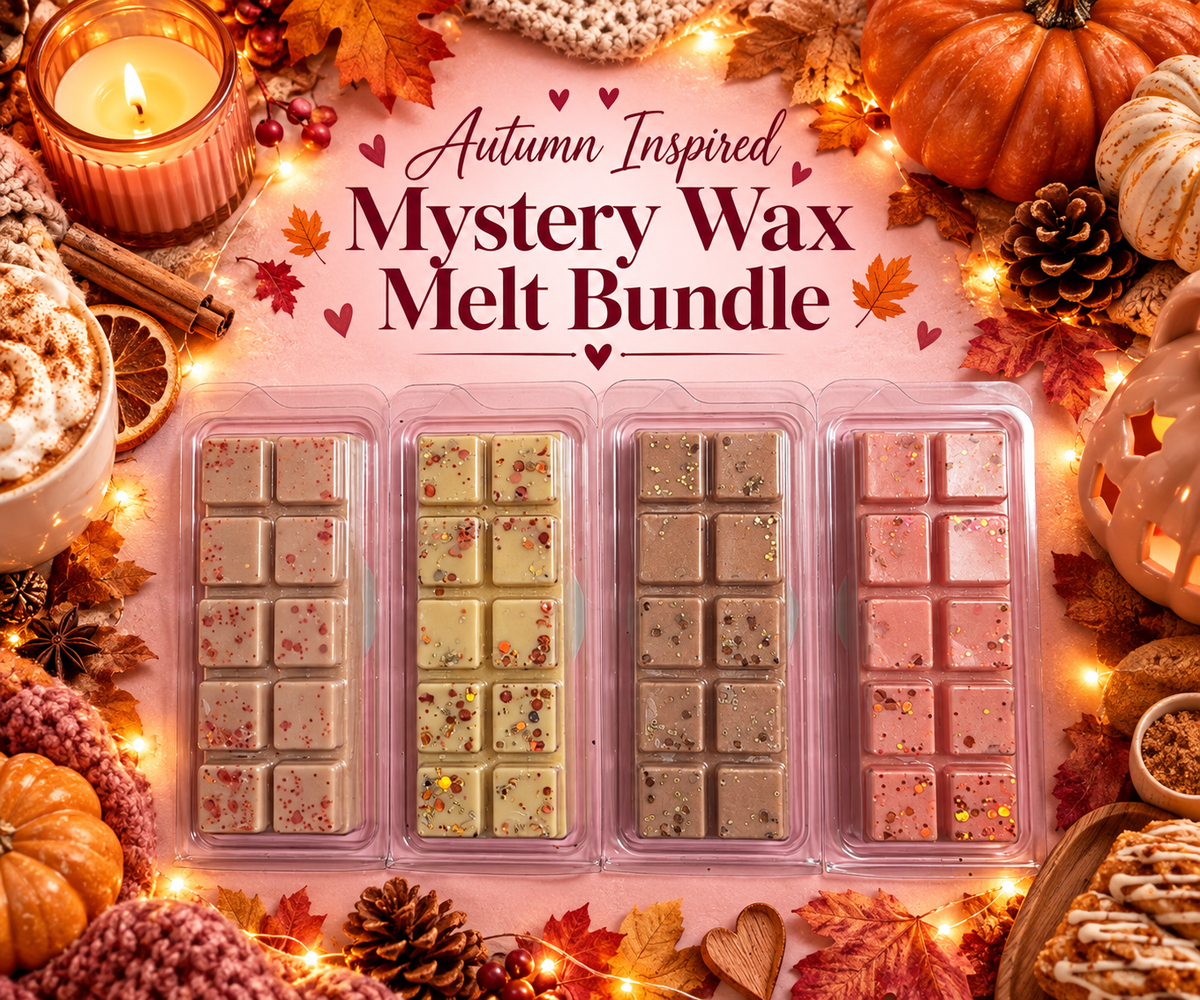 four packages of autumn-themed wax melts arranged in a flat-lay with fall decorations including pumpkins, candles, pinecones, and string lights. The text at the top reads 'Autumn Inspired Mystery Wax Melt Bundle'.