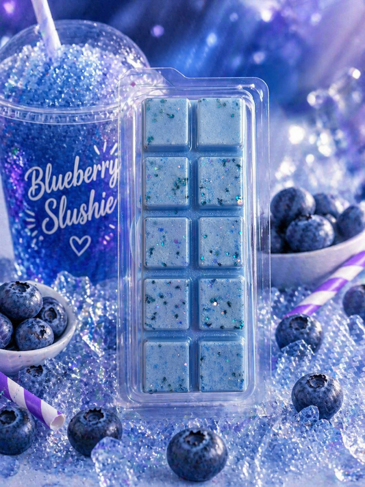 Blueberry wax melts with blue slushie and berries on a blue background