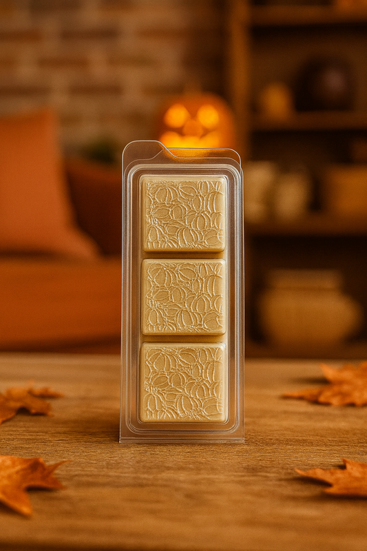 A soothing wax melt in warm, neutral tones, emitting a cozy aroma of cashmere, almond milk, delicate florals, musks, and subtle spices, perfect for relaxing moments.