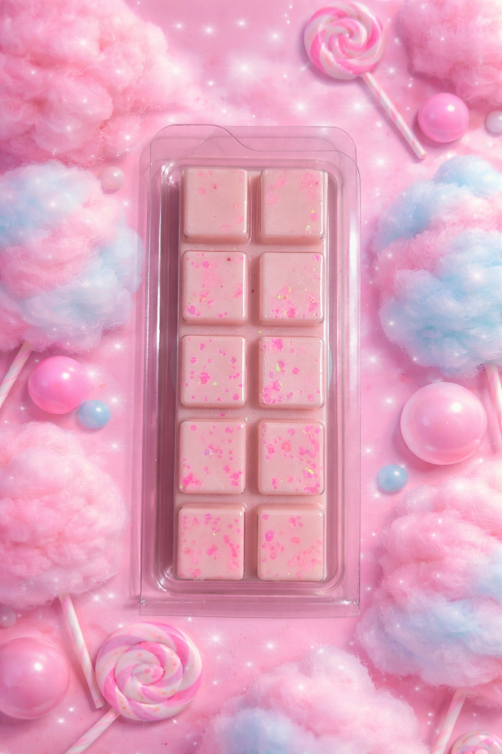Pink wax melt bar with candy decorations on a pink background