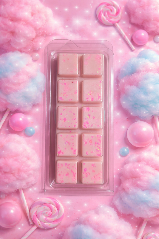 Pink wax melt bar with candy decorations on a pink background