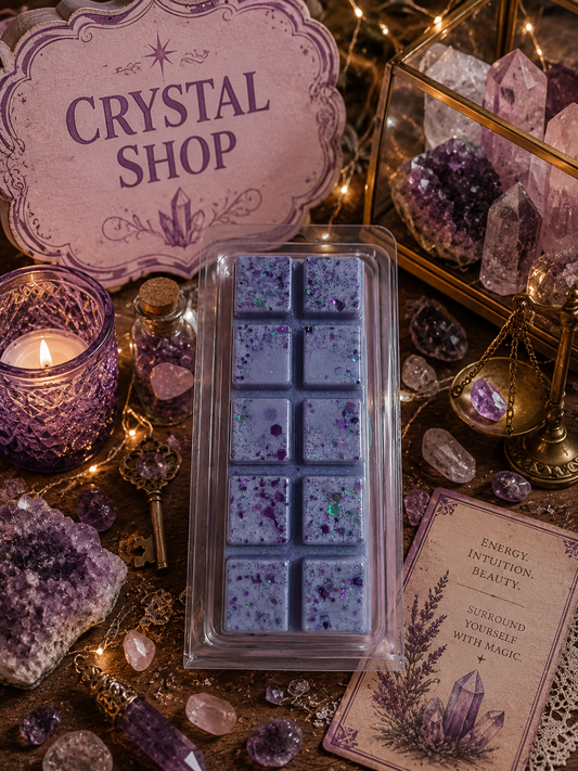 Box of purple wax melts on a table with crystals and a 'Crystal Shop' sign.