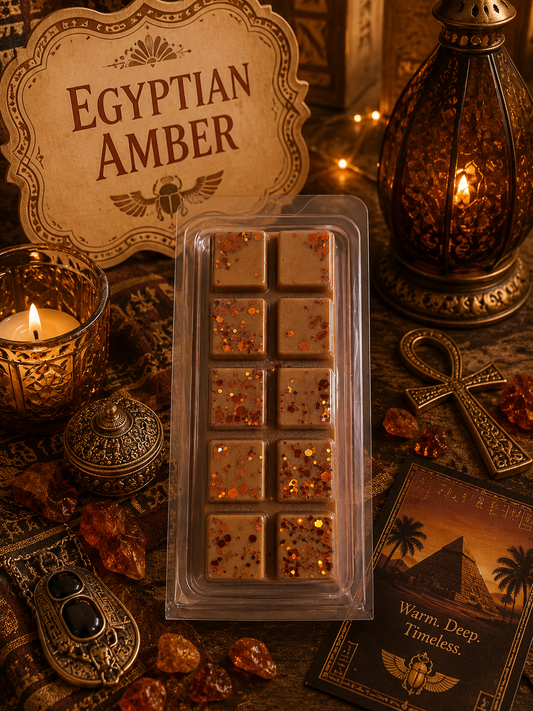Packaged Egyptian Amber wax melts with decorative lantern and candles on a rustic background