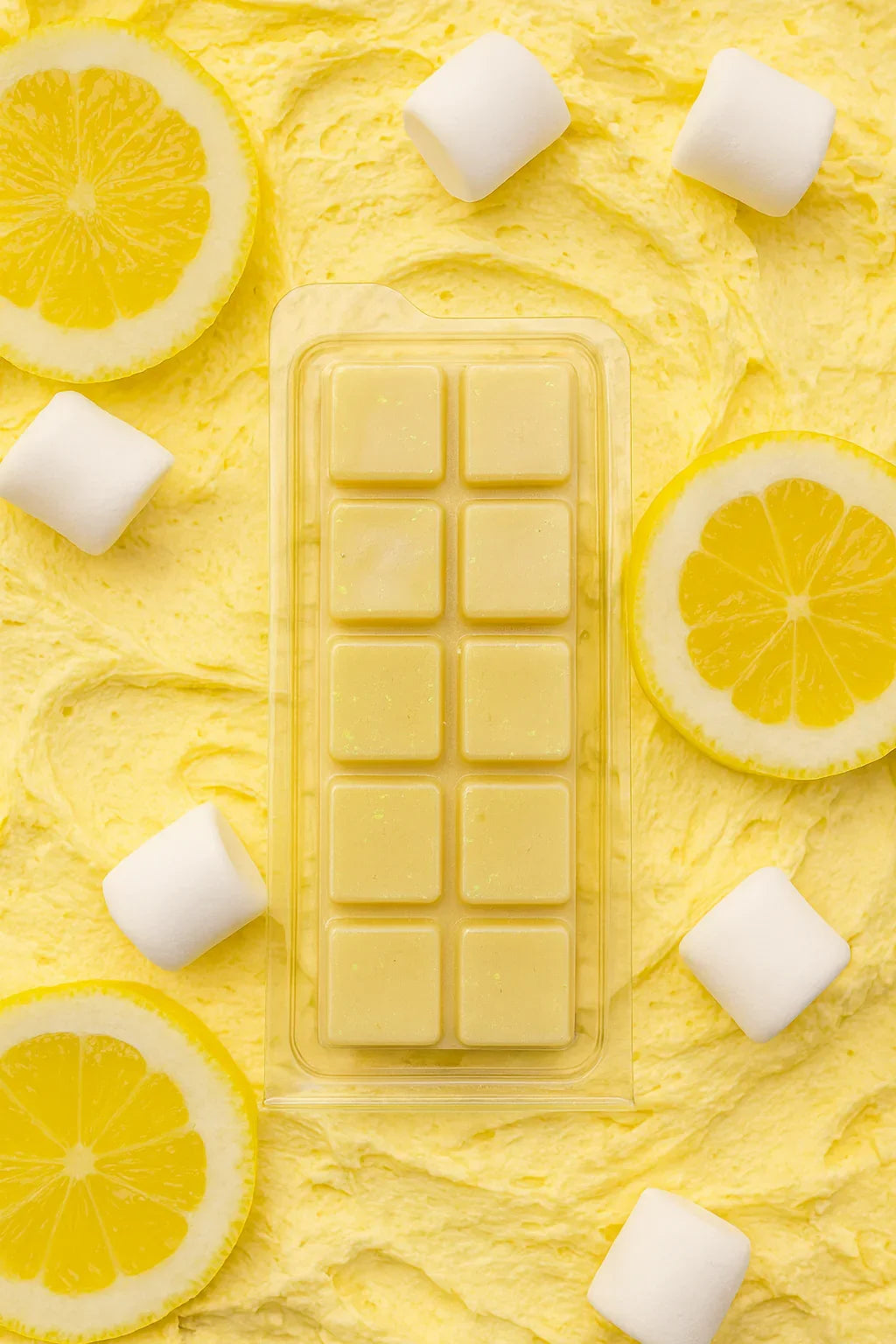 Yellow wax melt bar with marshmallows and lemon slices on a yellow background