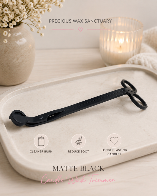 Matte black candle wick trimmer on trinket dish