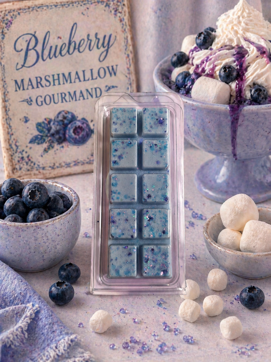 Blueberry marshmallow gourmet wax melts with blueberries and white cream in the background