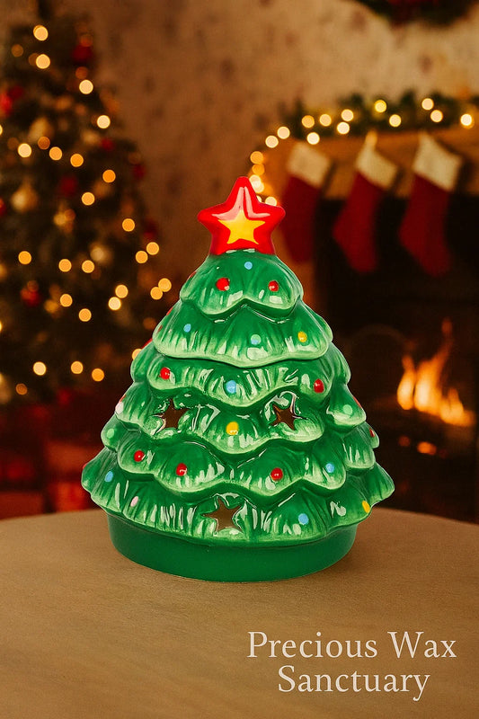 Decorative Christmas tree wax and oil warmer with lights on a table, Christmas tree and stockings in the background.