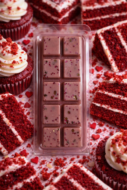 wax melt bar with red velvet cake pieces and cupcakes on a patterned background