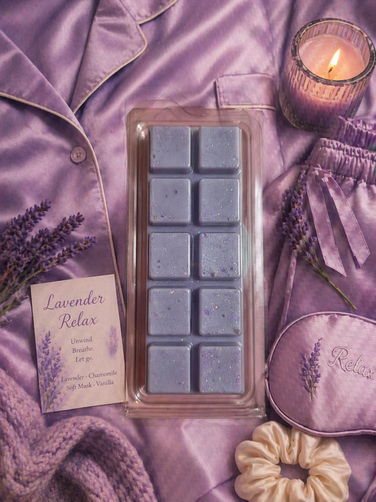 Wax melts in a mold on a purple satin surface with lavender-themed items.