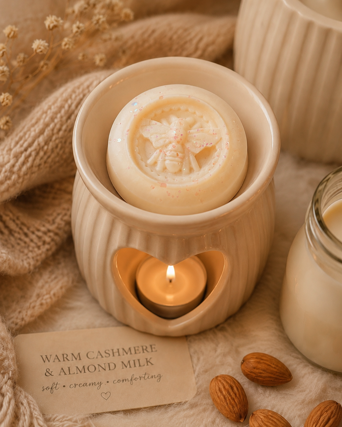 Warm cashmere wax melt in burner with cosy decor. 