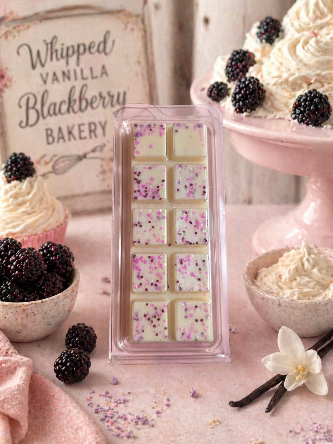 Bakery setting with a wax melt bar with floral patterns, blackberries, and vanilla beans.