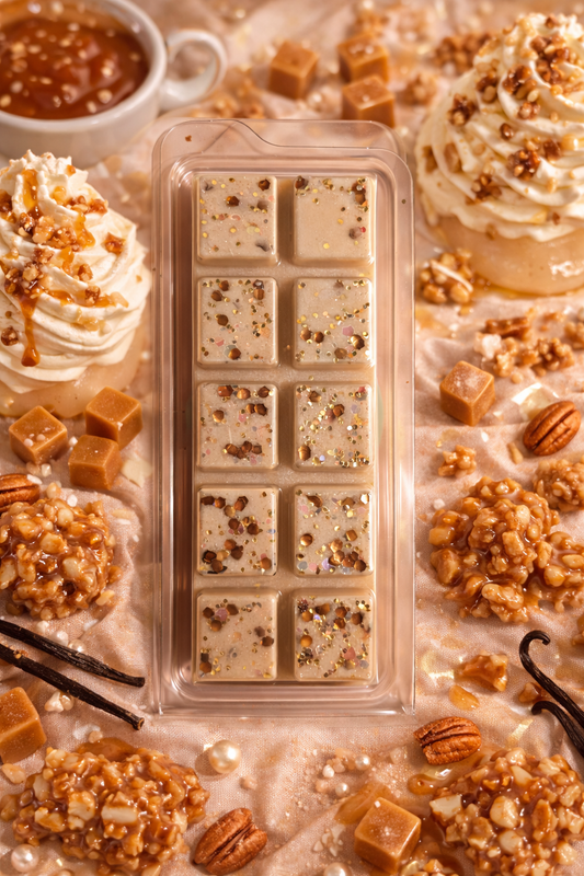 whipped vanilla praline wax melt bar surrounded by desserts and ingredients